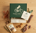 Happy Tails Club packaging with dog treats on a wooden surface